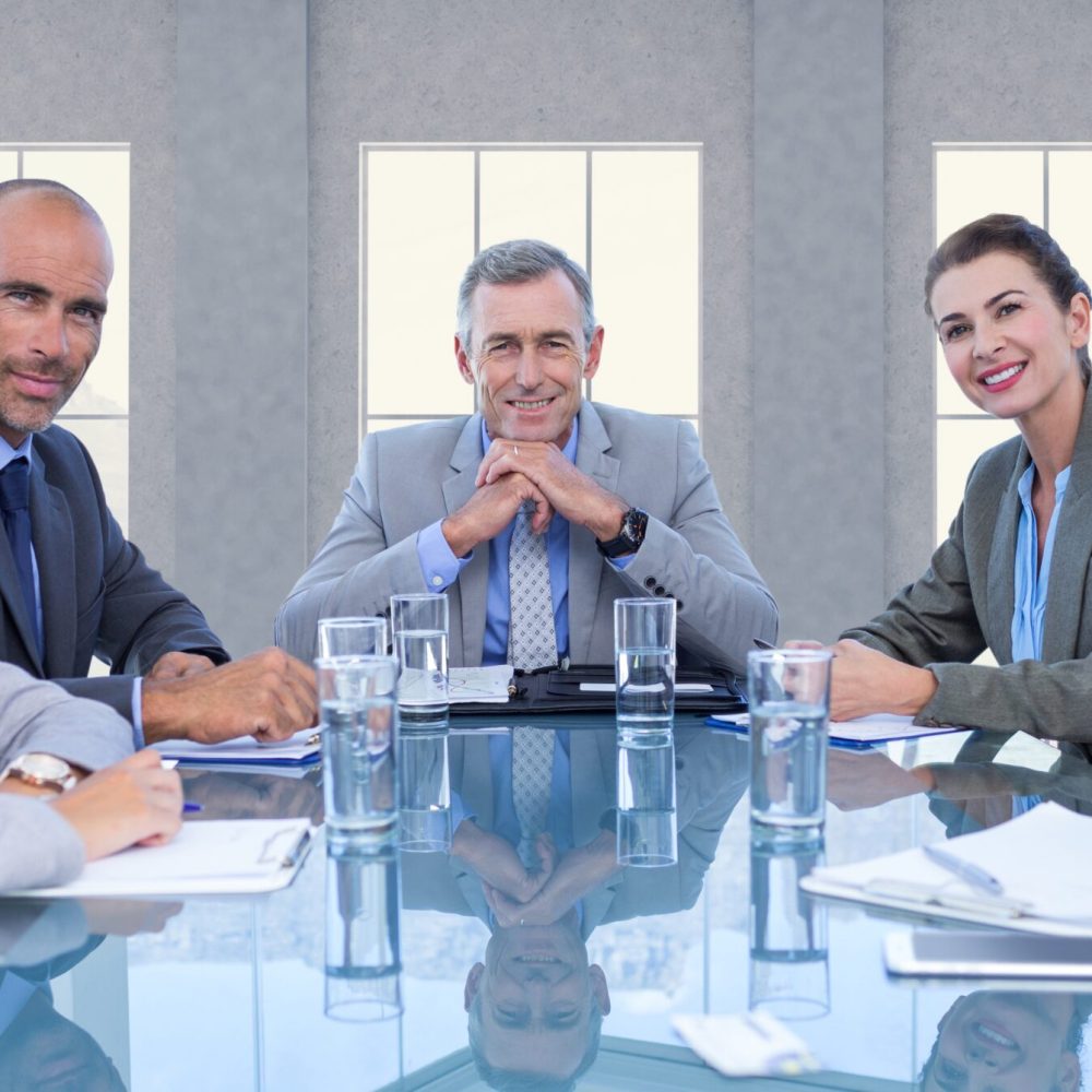 Portrait of confident business executives sitting in a conference room